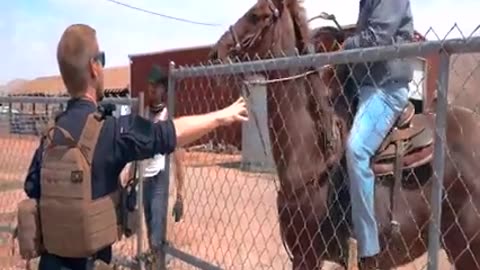 Man on horse ropes and drags my partner.