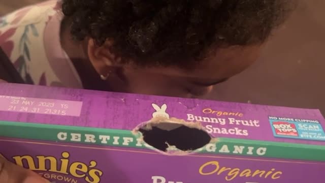 Mom Catches Child Trying to Bite Her Way into Fruit Snacks