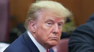 Trump captured sitting with defense in Manhattan court for indictment hearing