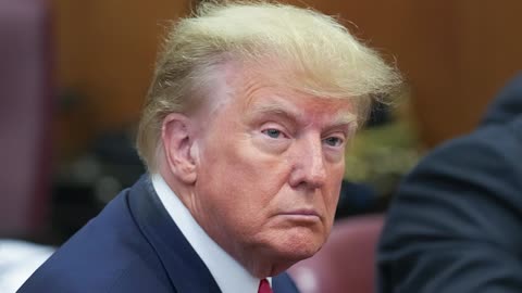 Trump captured sitting with defense in Manhattan court for indictment hearing