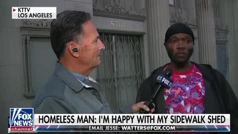 Homeless man named “Q” is happy with his sidewalk shed