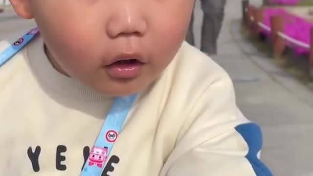 What a cute child please try to laugh