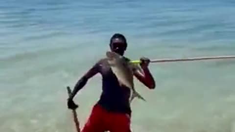The fisherman then drops the line into the water