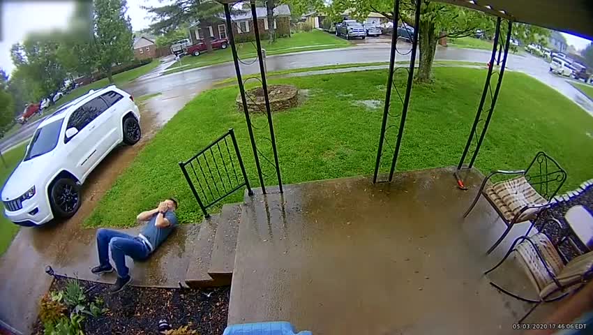 Man Faceplants on Slippery Stairs While Running Toward Front Door of His House in Rain