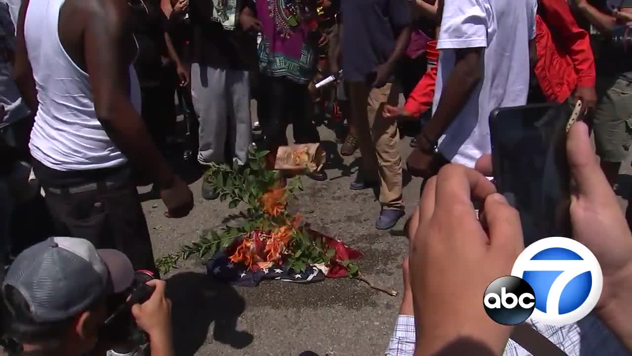 Maxine Waters supporters burn flag, yell, 'America was never great!'