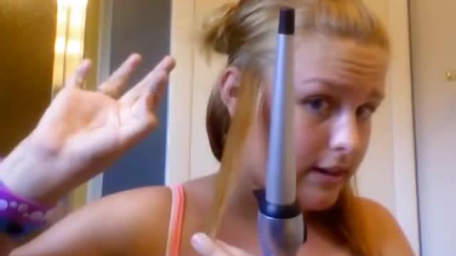 Girl gets hair burnt off with curling iron