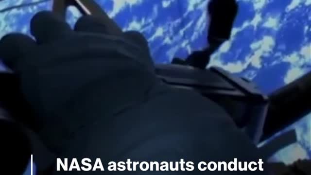 NASA astronauts conduct spacewalk outside the International Space Station