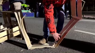 French farmers block road, set up camp to protest trade deal