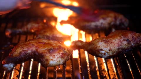 Grilled chicken thighs on fire
