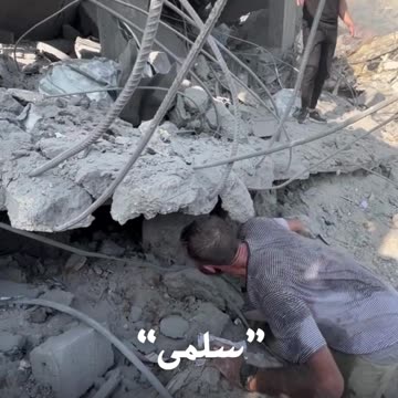 Palestinian man looks for family trapped under rubble in Gaza