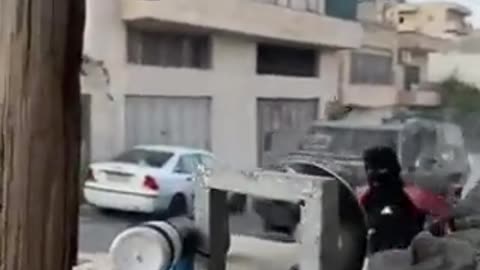 An Israeli Jeep trying to run over a Palestinian young man during confrontations