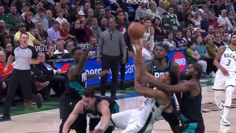 Giannis Antetokounmpo was acting like he broke his neck after this nasty foul😂