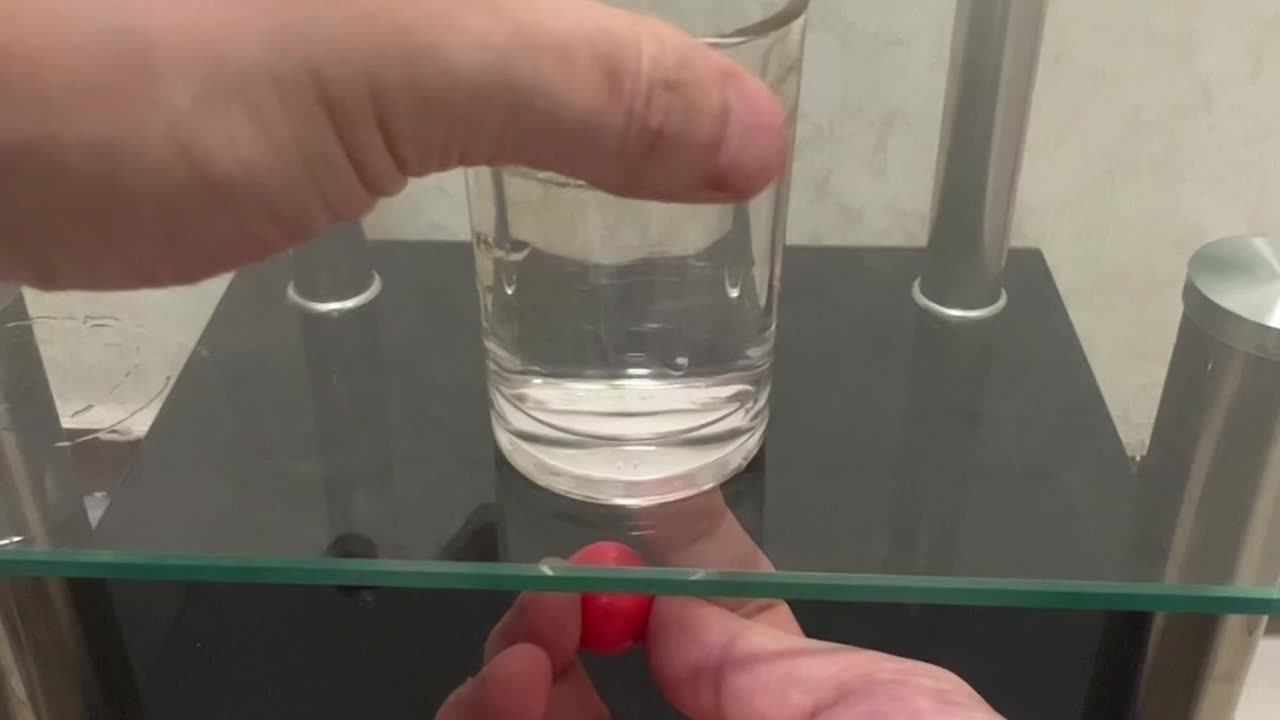 Red Ball Under Glass Table Magic Trick