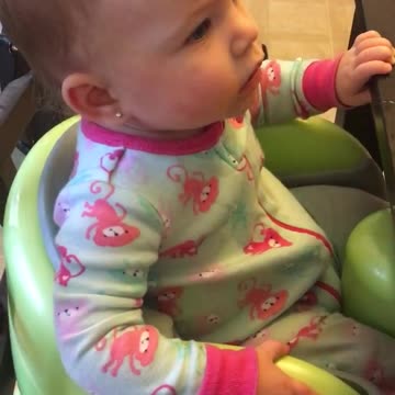 Baby "barks" and the family dog answers