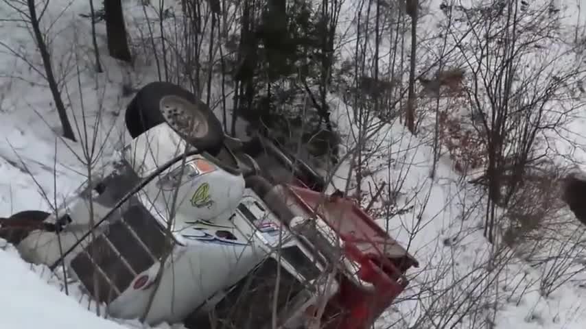 Big Rig Truck Slides into Snowy Ditch