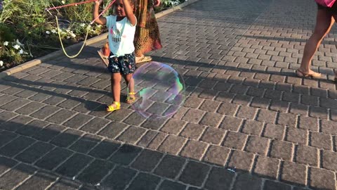 Children Playing With Bubbles