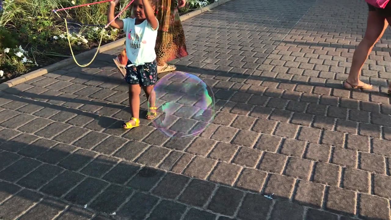 Children Playing With Bubbles