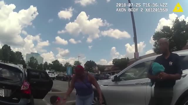 Atlanta police officer rescues baby locked in hot car.