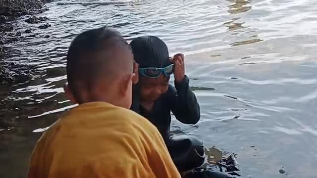 child is playing on the beach