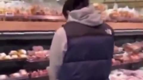 Young Islamist in the Netherlands urinates on the pork section