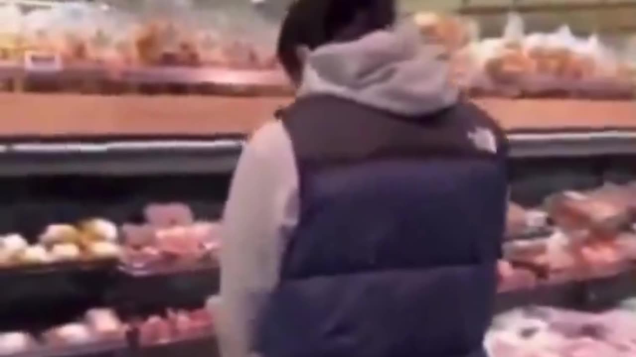 Young Islamist in the Netherlands urinates on the pork section