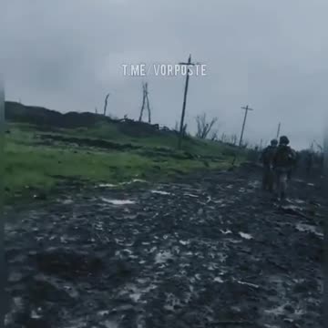 Russian mortar fire falling near Ukrainian soldiers on a Bakhmut road.