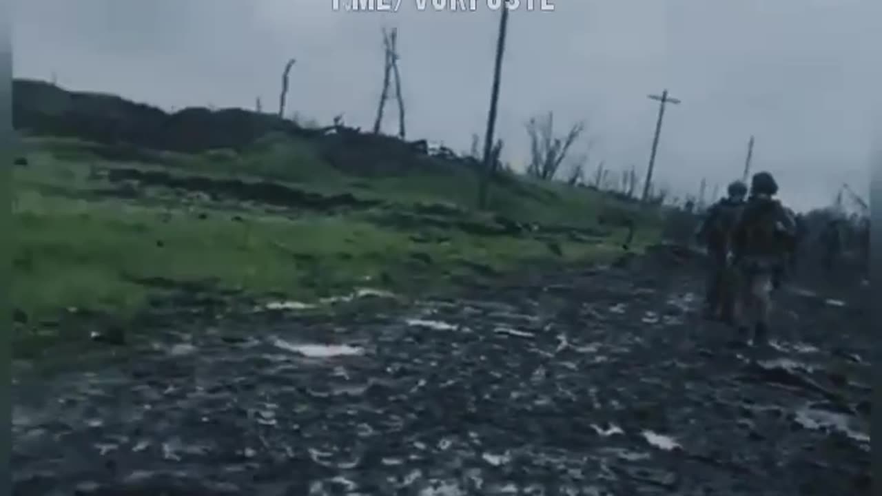 Russian mortar fire falling near Ukrainian soldiers on a Bakhmut road.