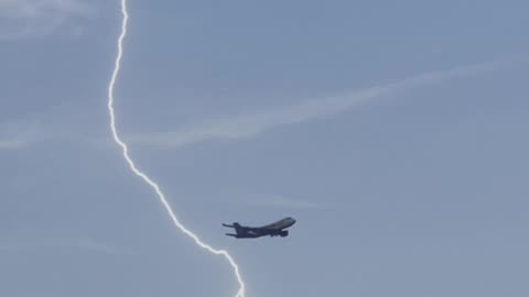 The lightning thundering raining plane flight