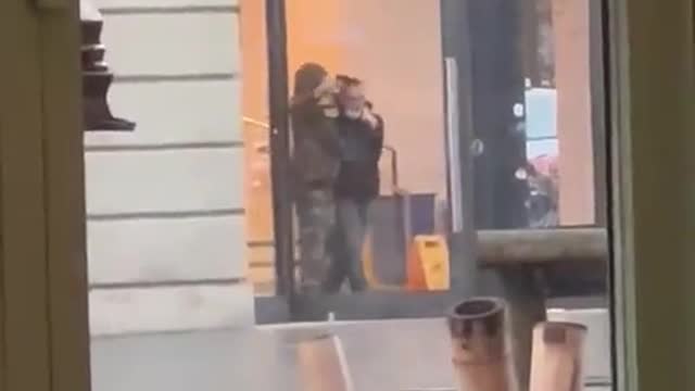 Footage from across the road shows the hostage taker waving a gun