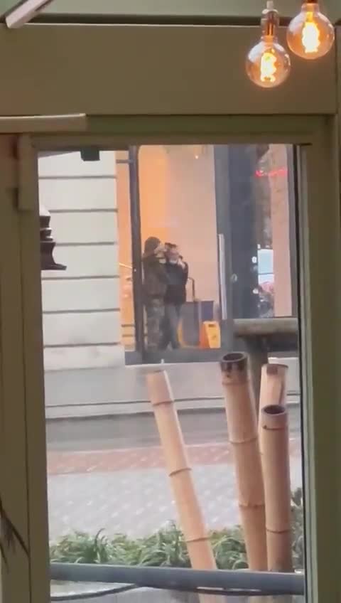 Footage from across the road shows the hostage taker waving a gun