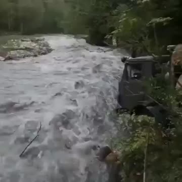 Scale of a truck driver crossing a stream