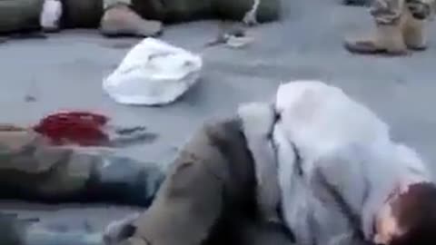 Additional angle of Ukrainian soldiers torturing Russian prisoners.