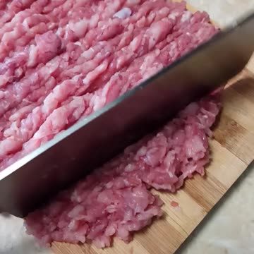Chopping meat for yummy burgers