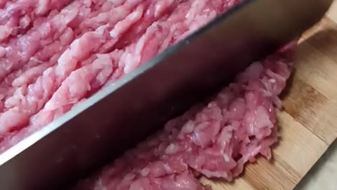 Chopping meat for yummy burgers