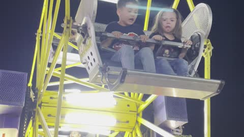 Brother Loves the Mini Ferris Wheel but Daughter Has Different Thoughts