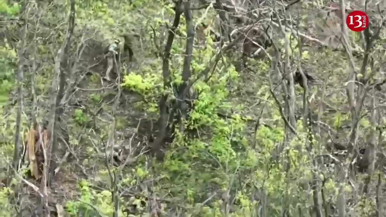 Russian soldier surviving a battle, taken hostage by Ukrainian soldier in a wooded area