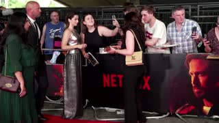 Fans gather for ‘The Gray Man’ premiere amid heat wave