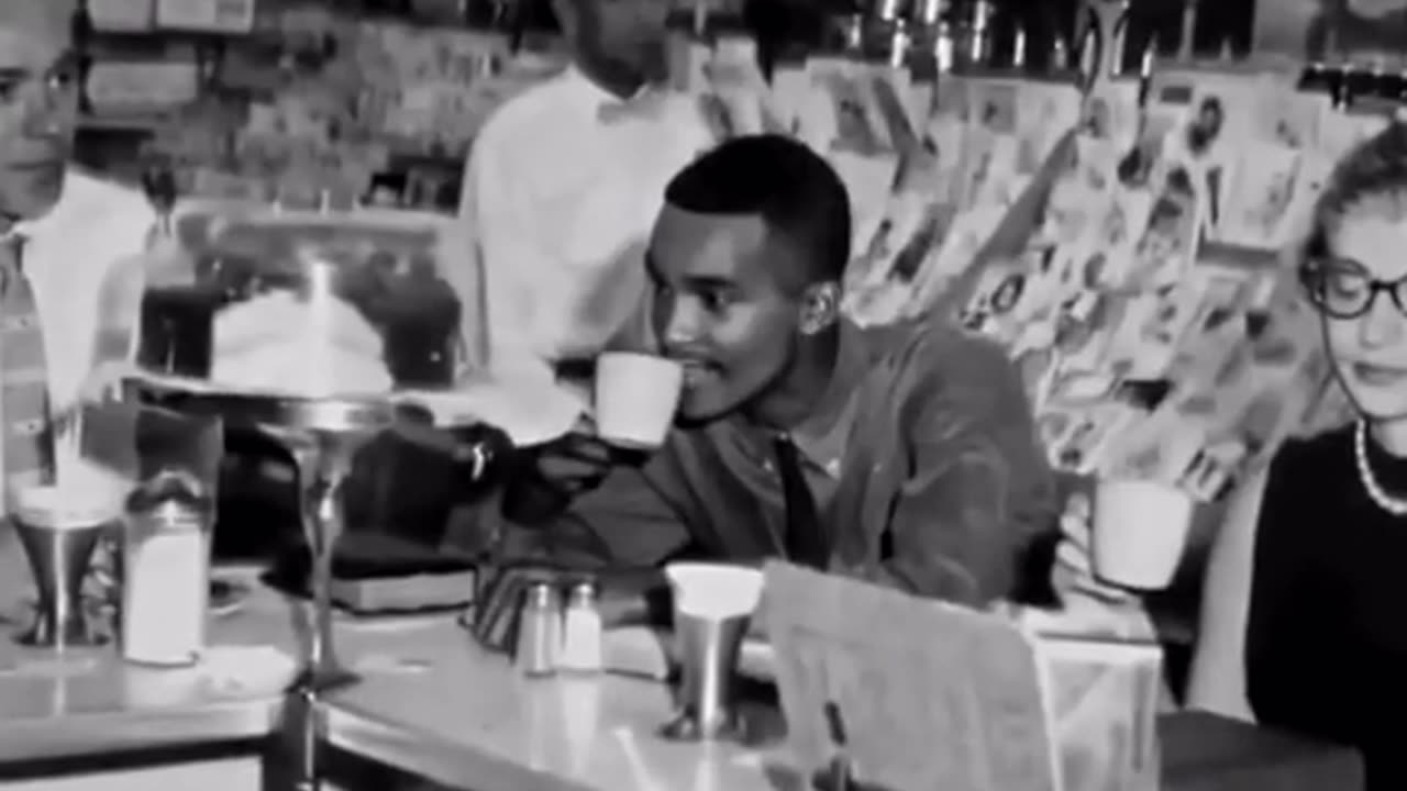 Civil rights activist reacts to food after finally being served at "white only" restaurant