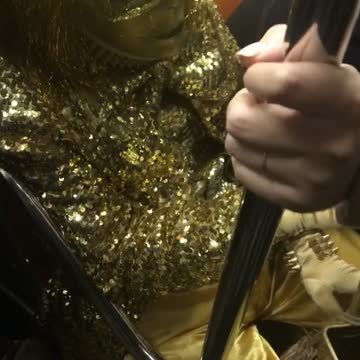 Person sprinkle sparkle all gold subway sitting