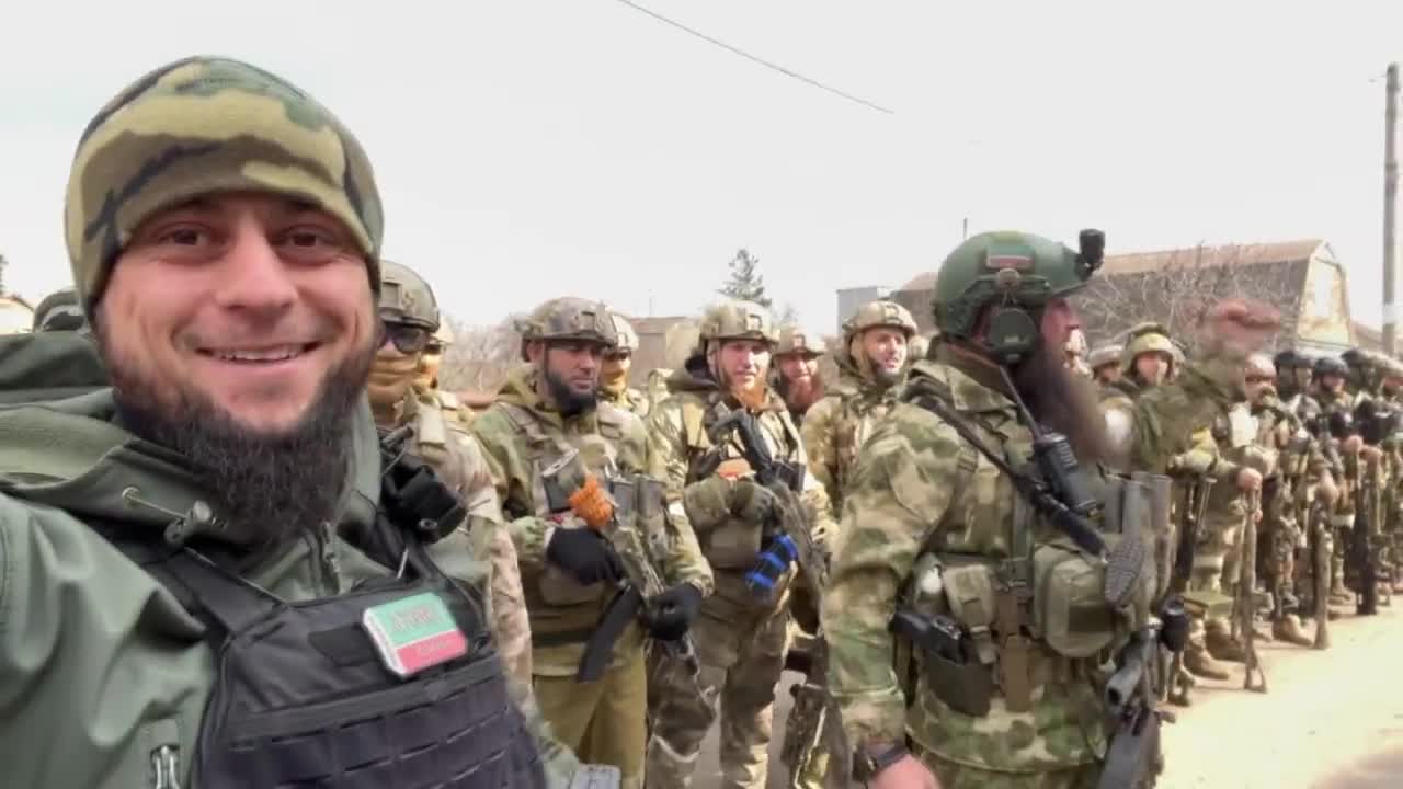 Chechen minister of information Akhmed Dudayev with unit from Russian Guard in Mariupol