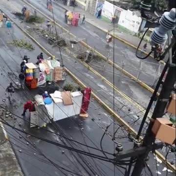 Ecuador: Protesters use shields as General Strike continues.