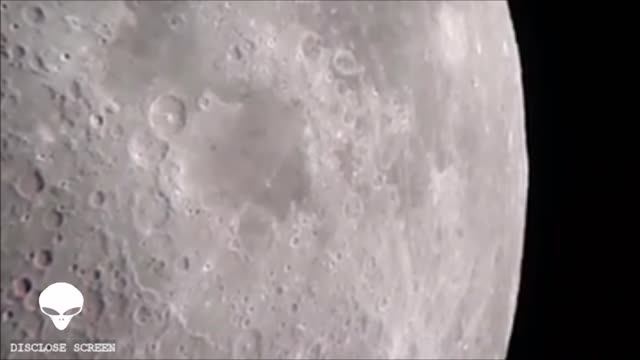 UFO seen casting a shadow on the Moons surface.