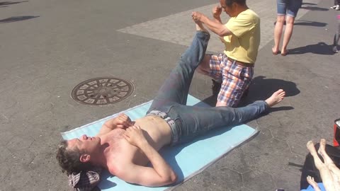 Luodong Massages Shirtless White Man On Sidewalk