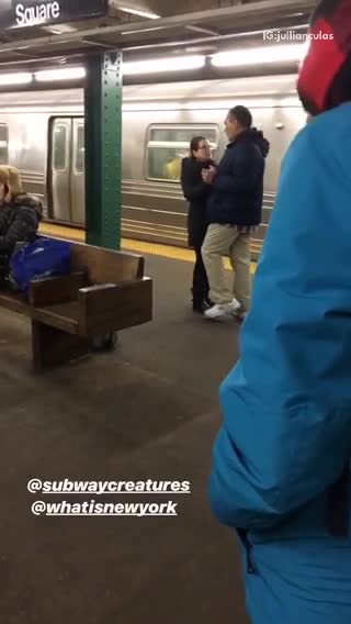 Couple slow dances at subway station