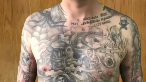 Ukrainian POW shows his Nazi tattoo collection.