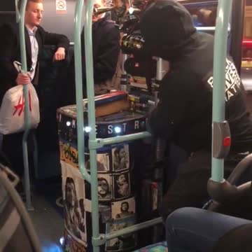 Guy with black lives matter jacket with blinking lights glowing cart in subway