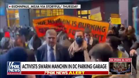 Left-wing activists swarm Joe Manchin in DC parking garage