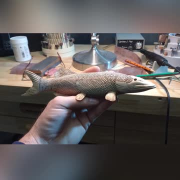 Miniature musky carving