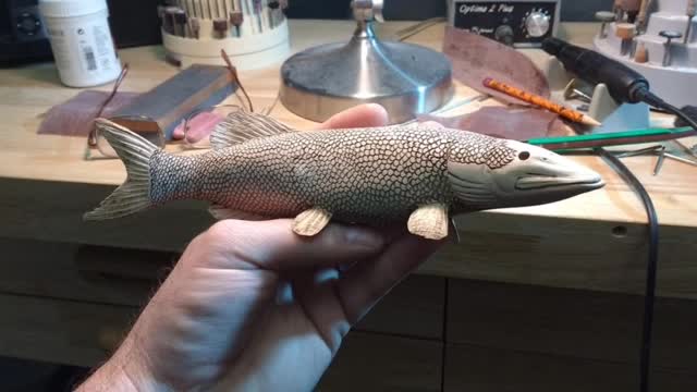 Miniature musky carving