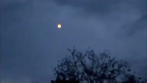 Person films UFO-shaped light